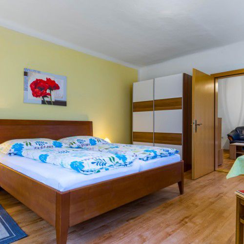 Double bed with blue bed linen