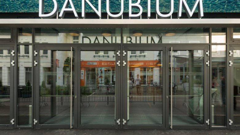 Entrance to the Danubium Tulln with glass front and large lettering.