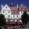 Historic building with hotel and café on the main square.