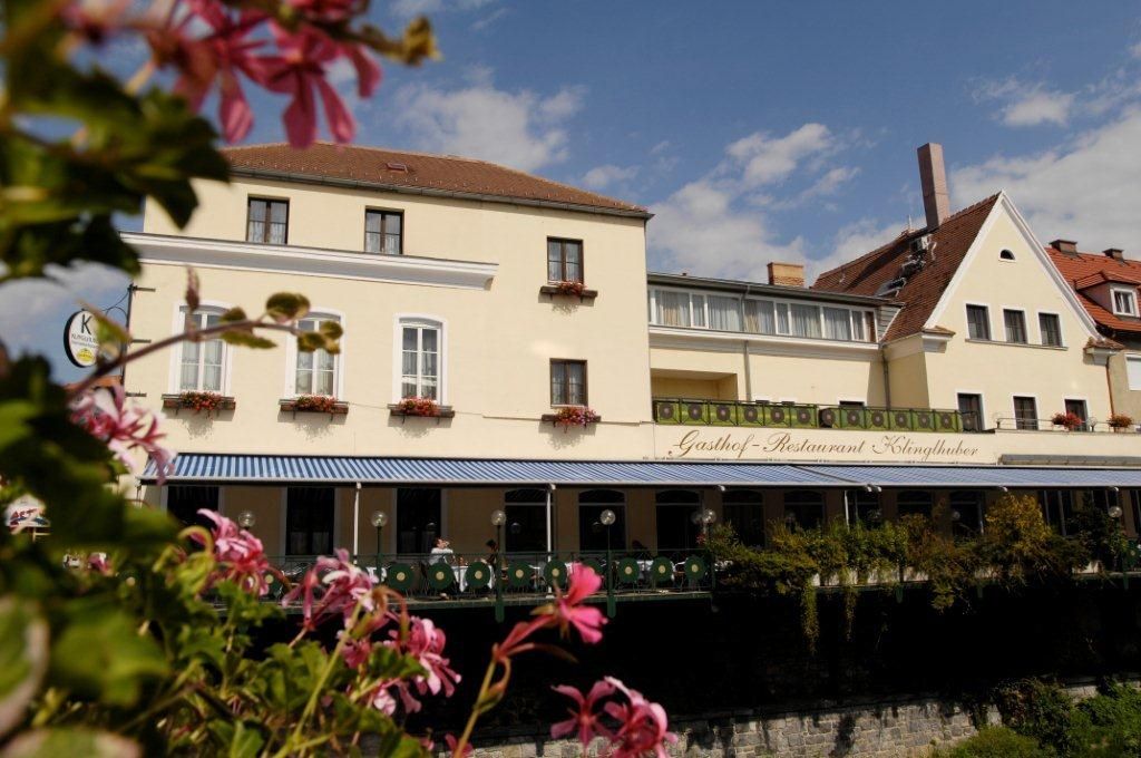 Hotel and Gasthof Klinglhuber with flowers in the foreground.