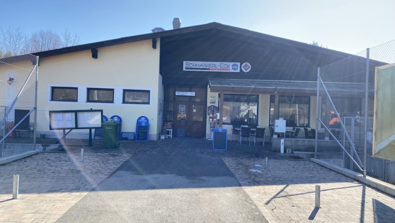 Exterior view of a building with the sign 'Schmankerl-Eck'.