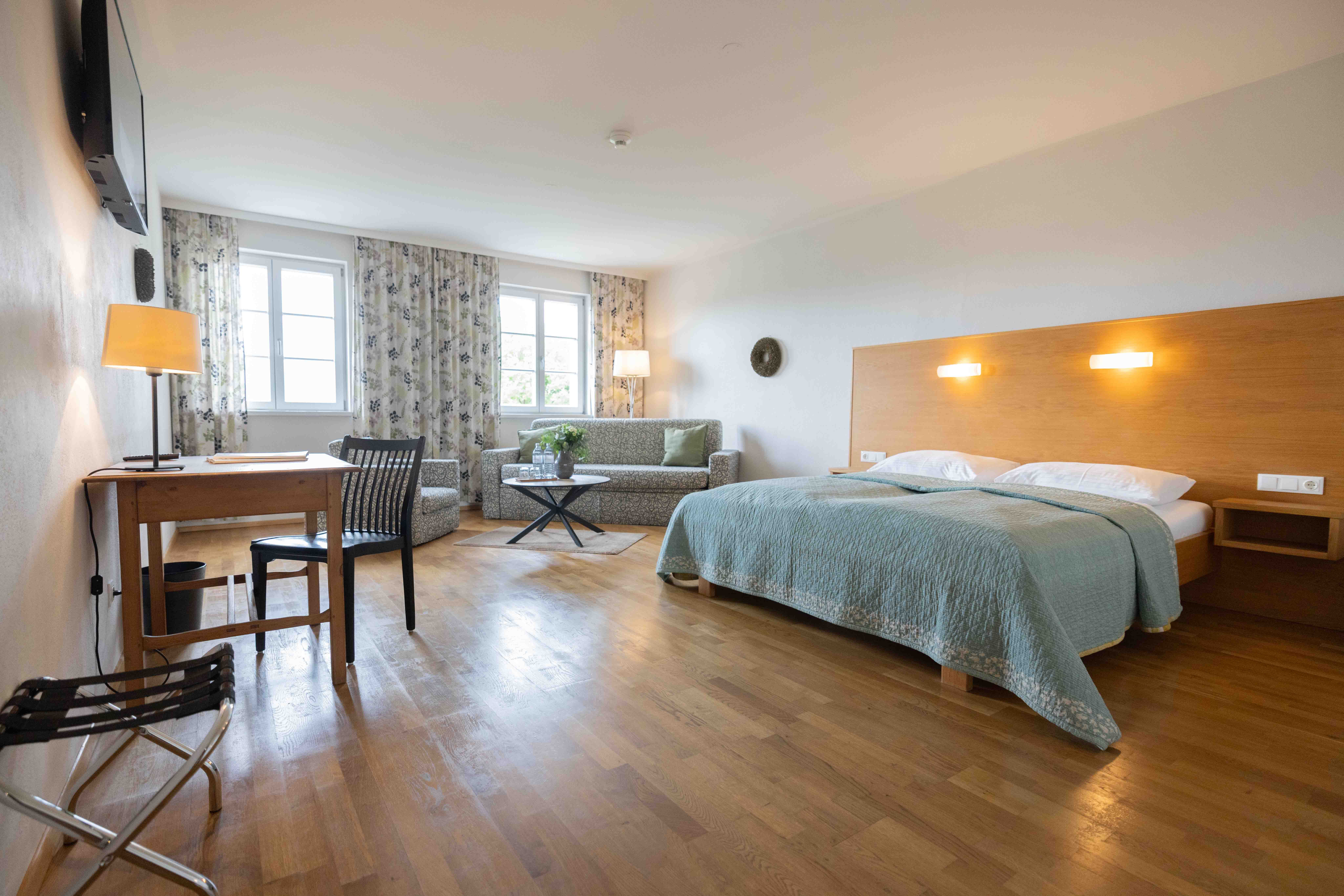 Double room with large bed and sofa