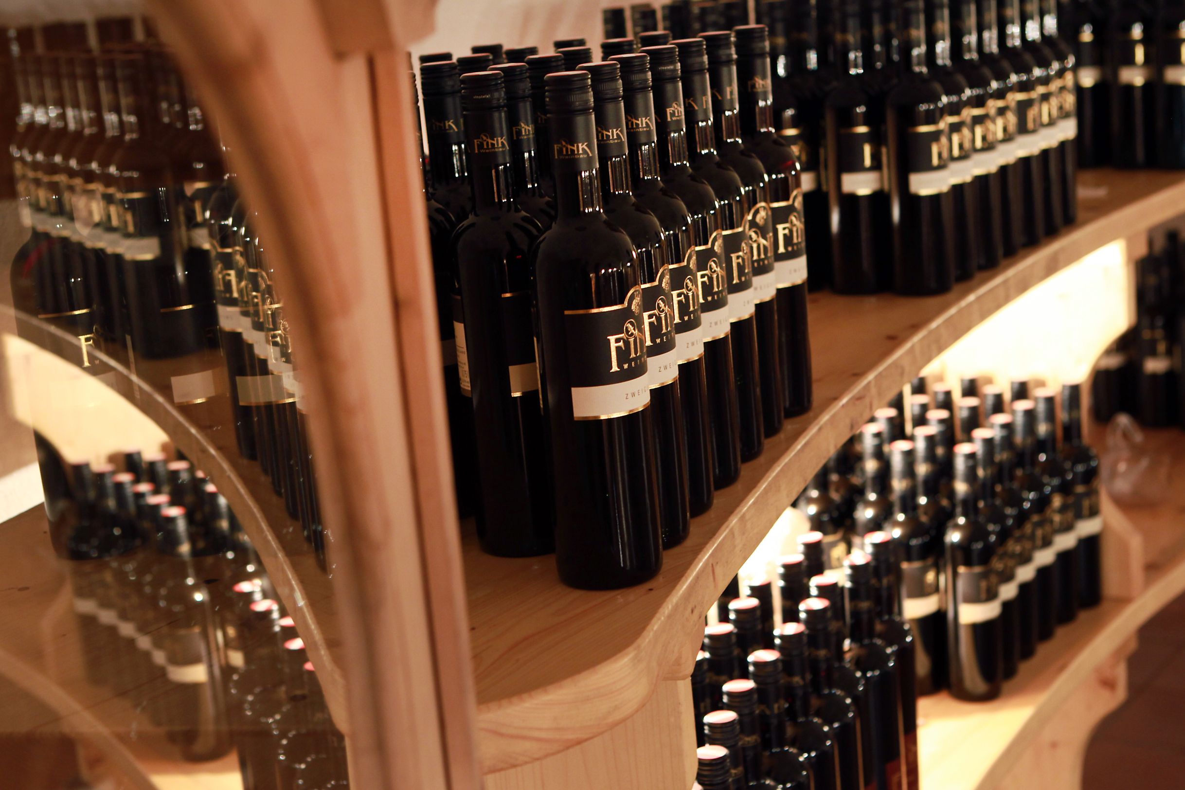 Shelves with wine bottles at the Fink winery.