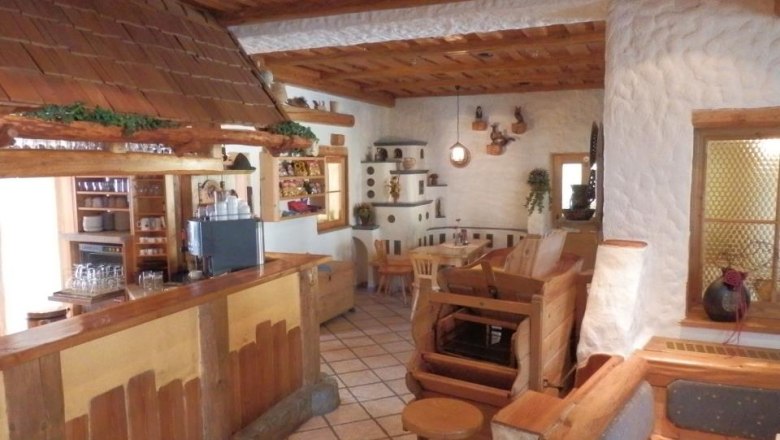 Cozy dining room with wooden furniture and rustic decor.