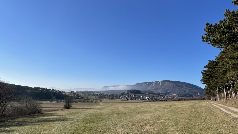 Landscape with meadow, hills and clear sky.