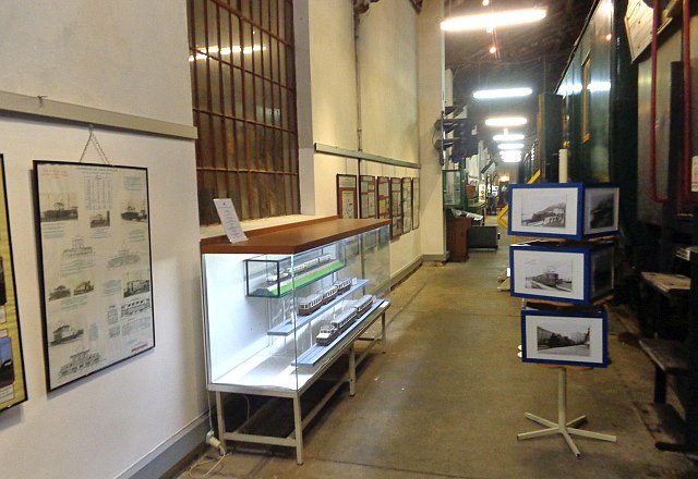 Interior view of the Schwechat Railway Museum with exhibits and information boards.