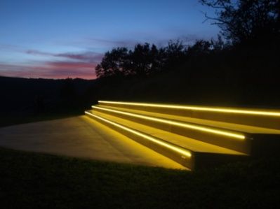 Illuminated steps outdoors at sunset.