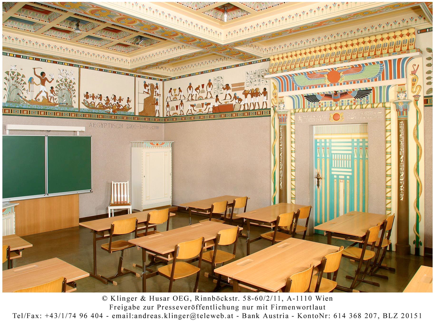 Egyptian-style classroom with murals and decorative door frame.