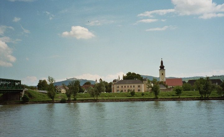 River landscape with church and bridge in Mautern, Austria.