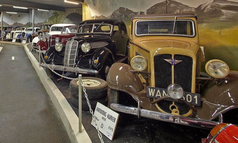 Row of classic cars in an automobile museum.