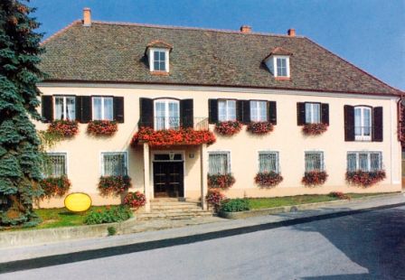 Traditional building with flowers on the windows.