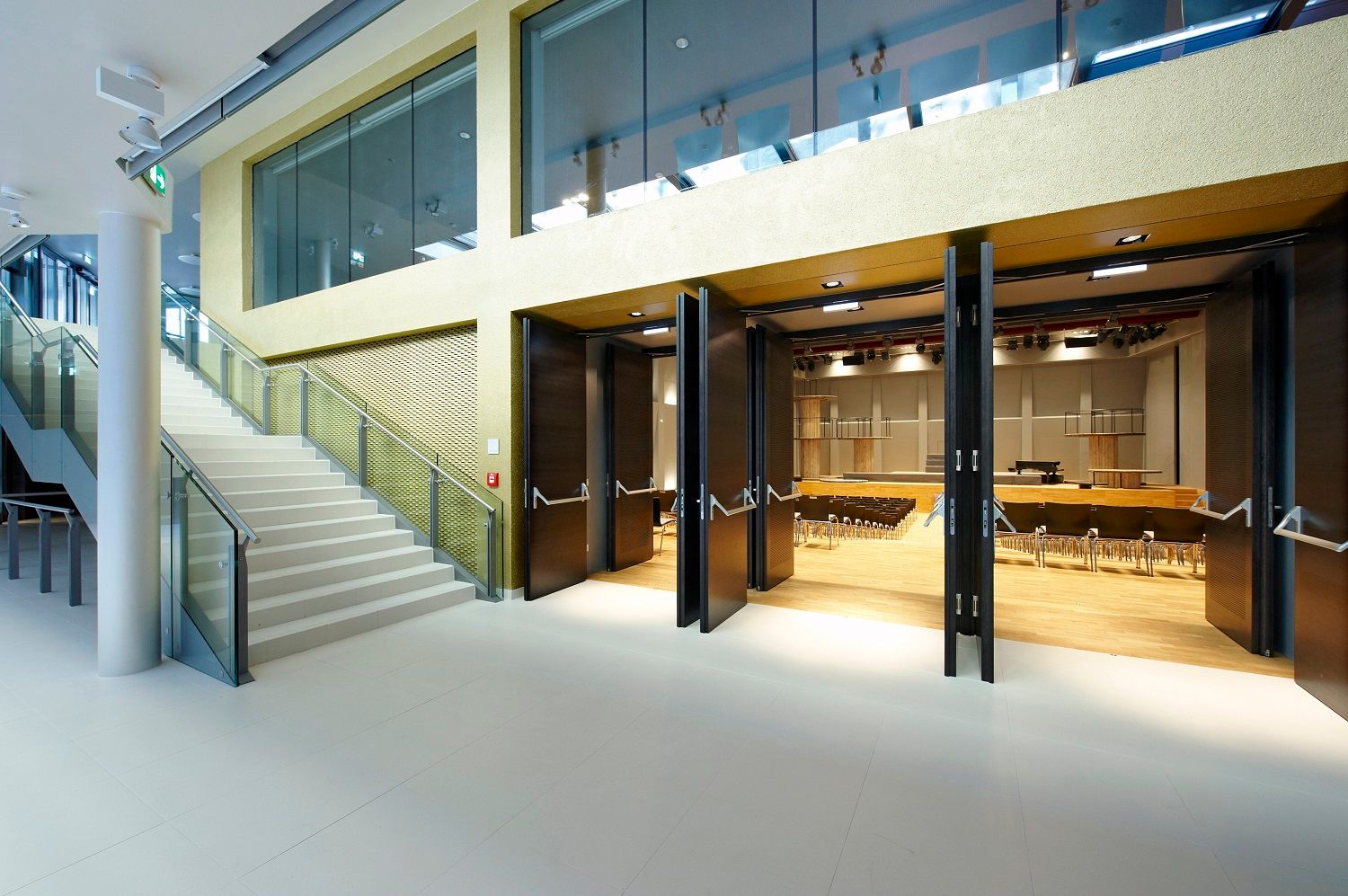 Modern interior with staircase and open hall.