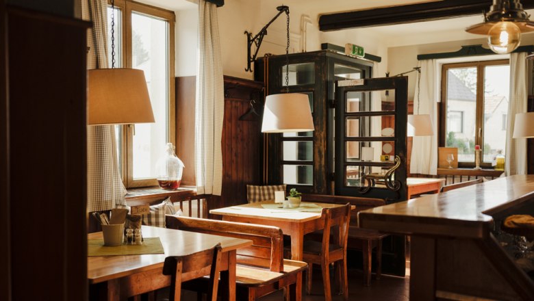 Cozy, rustic dining room with wooden furniture.