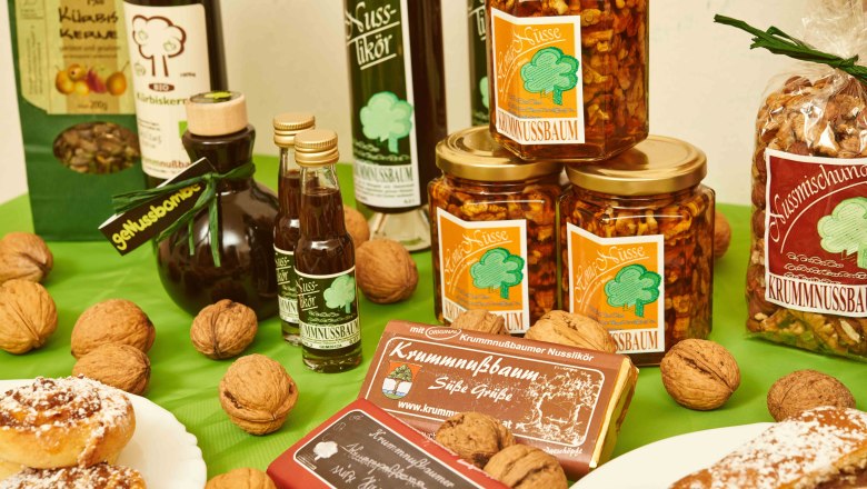 Various walnut products from Krummnussbaum arranged on a table.