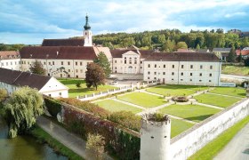 Aerial view of Geras Abbey with garden and tower in the foreground.