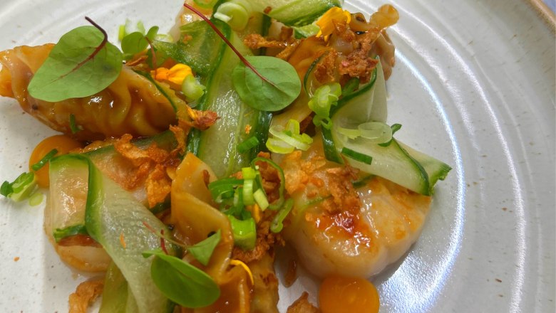 Pork & scallop gyoza, apricot sweet`n spicy, cucumber asazuke, fried onions, &copy; Hakan Aybar-Steiner