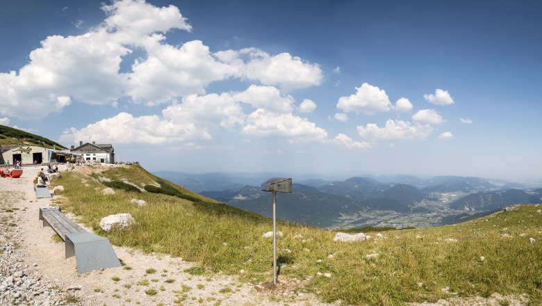 View from Schneeberg with mountain landscape and huts.