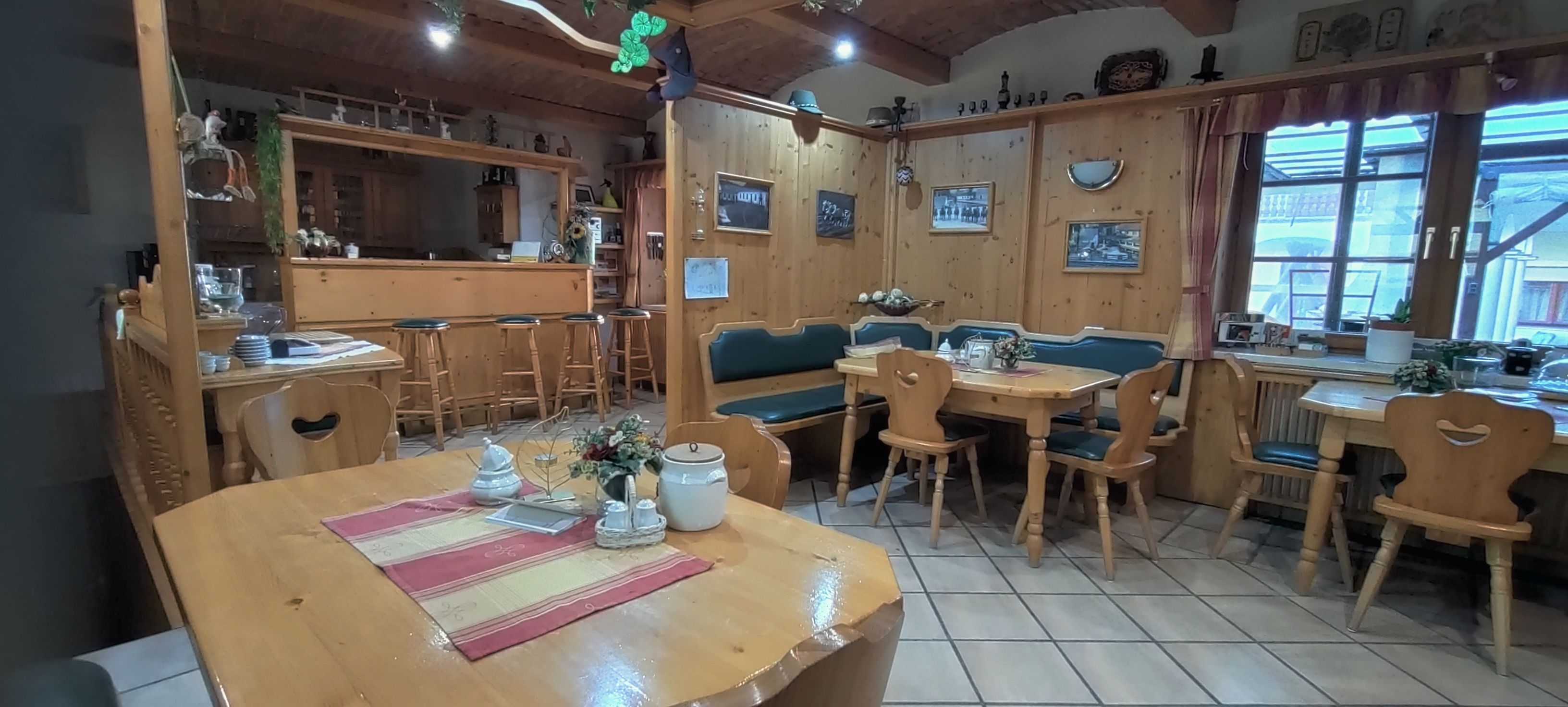 Cozy breakfast room with wooden furniture and decorations.