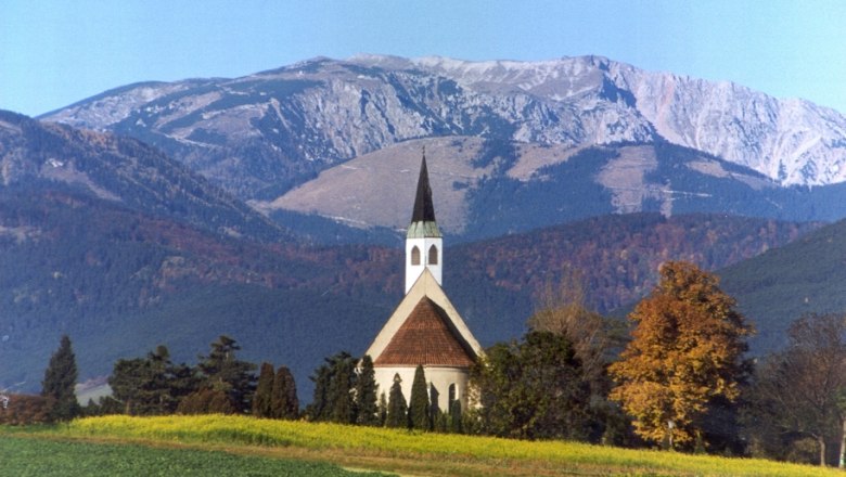 Church in front of a mountain landscape in Ternitz, Austria.