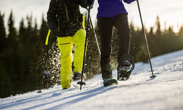 On snowshoes through the snow-covered landscape