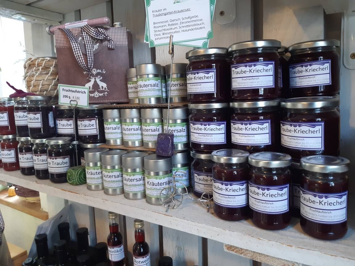 Shelf with jams and herbal salt in a farm store.
