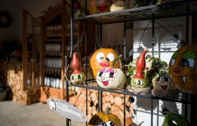 Painted pumpkins on a shelf