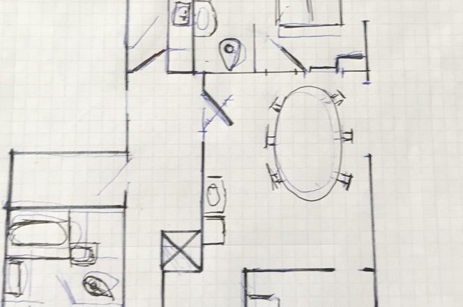 Hand-drawn sketch of an apartment floor plan on squared paper.