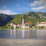 View of Dürnstein with the blue church and the Danube in the foreground.