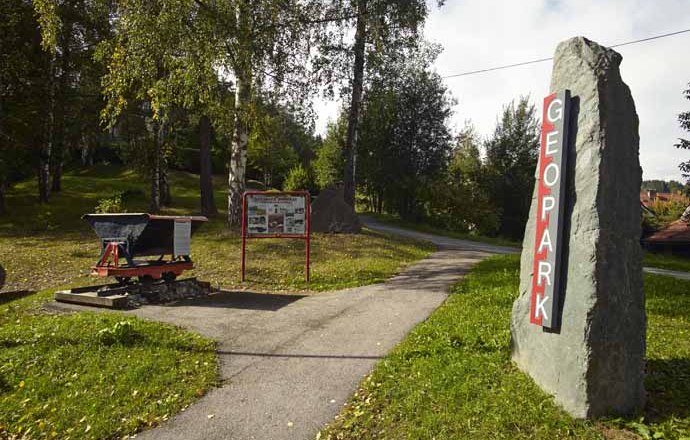 Entrance to the Aspang Geopark with signpost and information board.