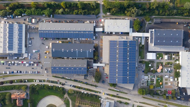 Aerial view of the Tulln exhibition center with several halls and solar panels on the roofs.