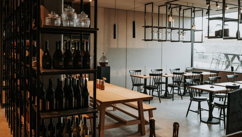 Wine rack, tables and armchairs