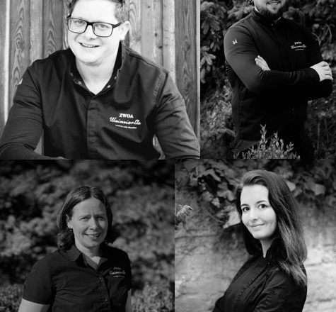 Four people in black and white portraits, smiling and posing in work clothes.