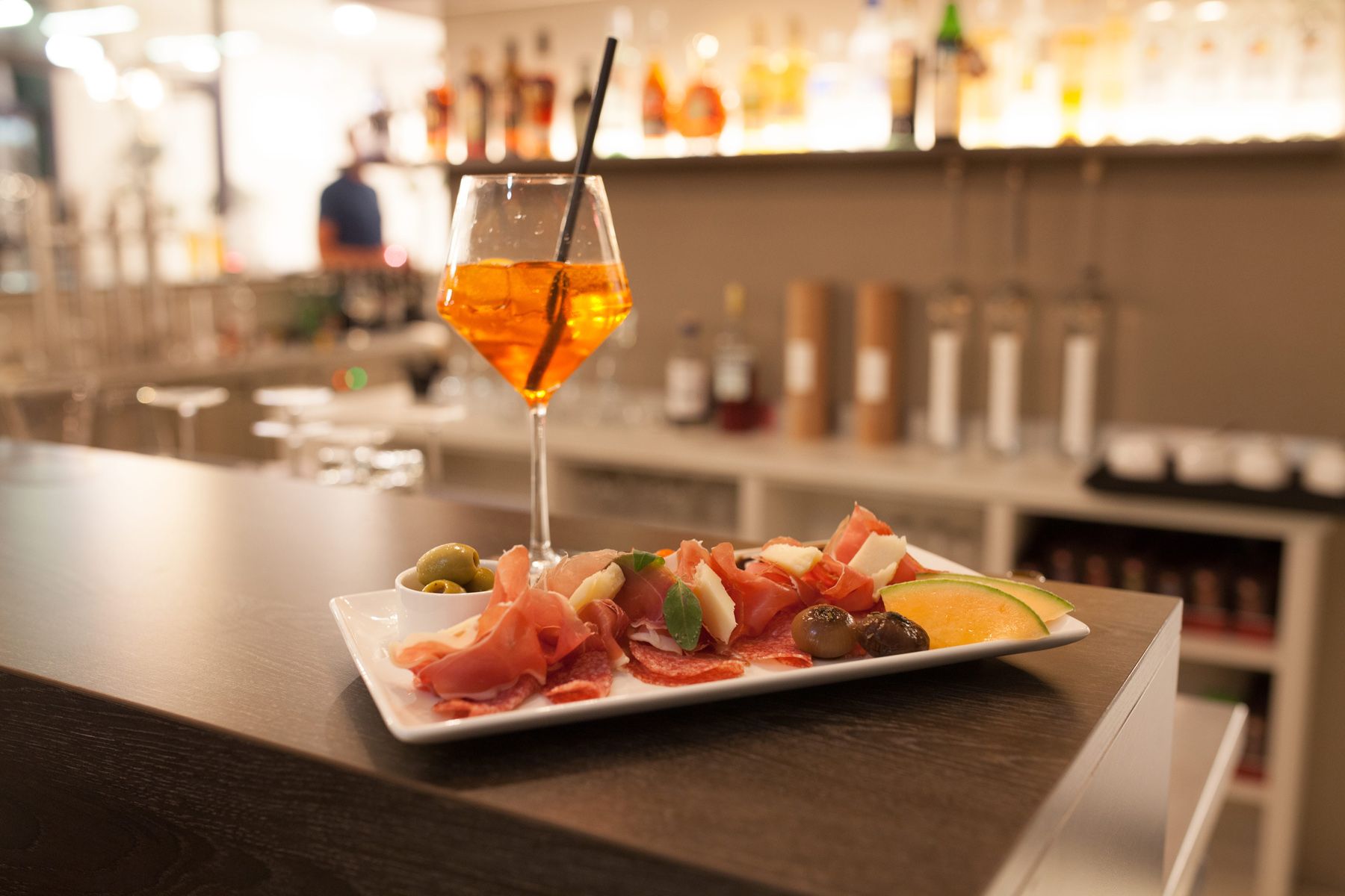 Small snack and drink in a wine glass at the hotel bar