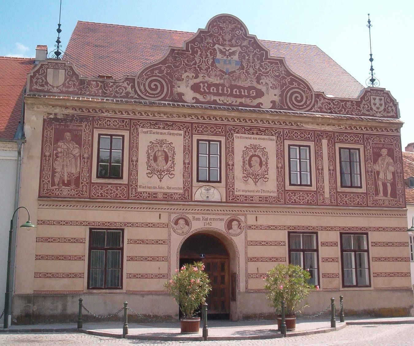 Historic town hall in Drosendorf-Zissersdorf with ornate facade paintings.