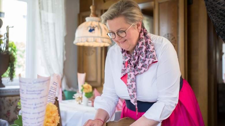 Landlady Maria-Luise serves apricot dumplings