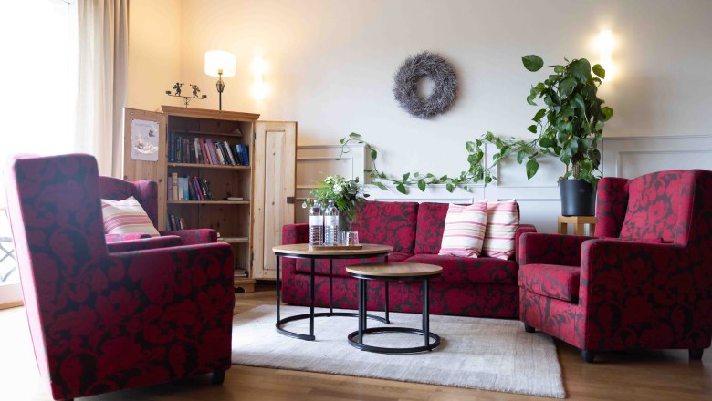 Lounge area with red sofa furniture and coffee table