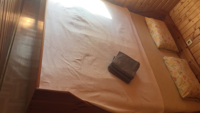 Cozy bedroom in a 100-year-old baggage car, © M. Schorn