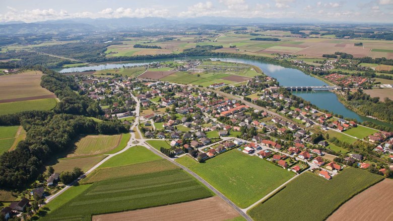 Aerial view of Ernsthofen with river and bridge.