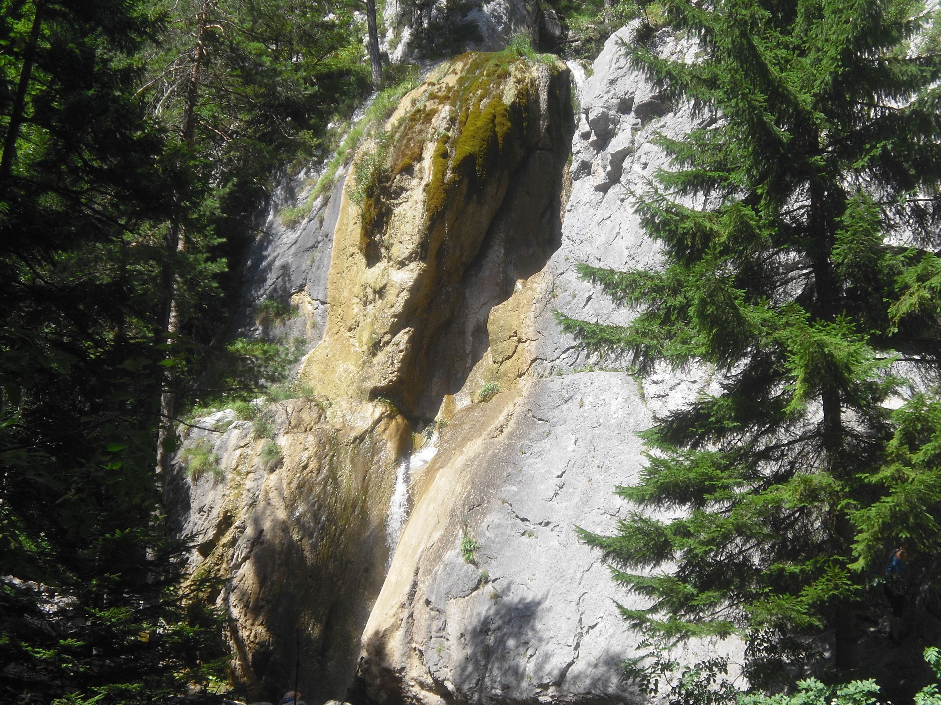 Sebastian waterfall in Puchberg with rocks and trees.