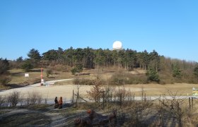 Landscape with hills, forest and radar dome on the Buschberg.