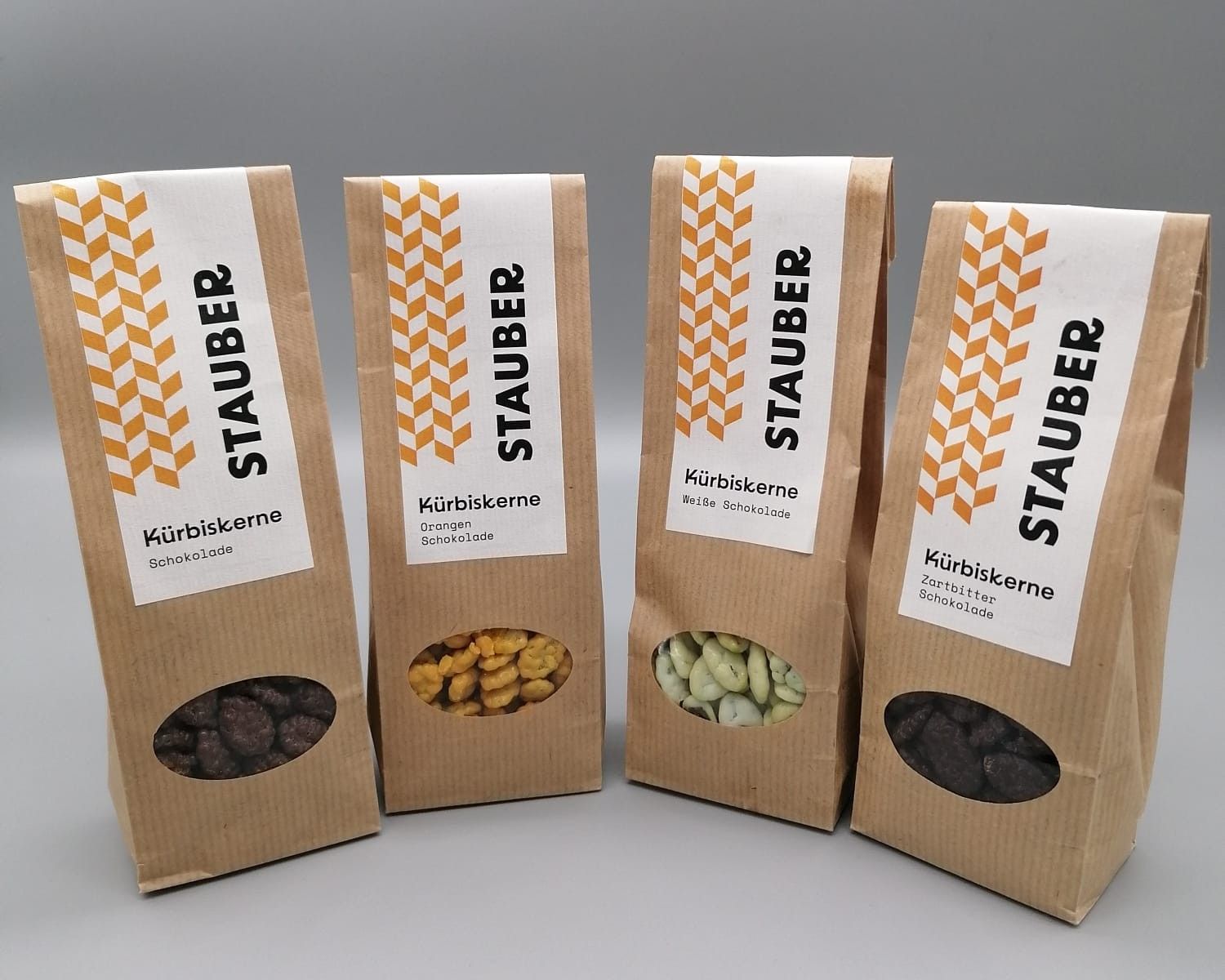 Various roasted pumpkin seeds in packaging