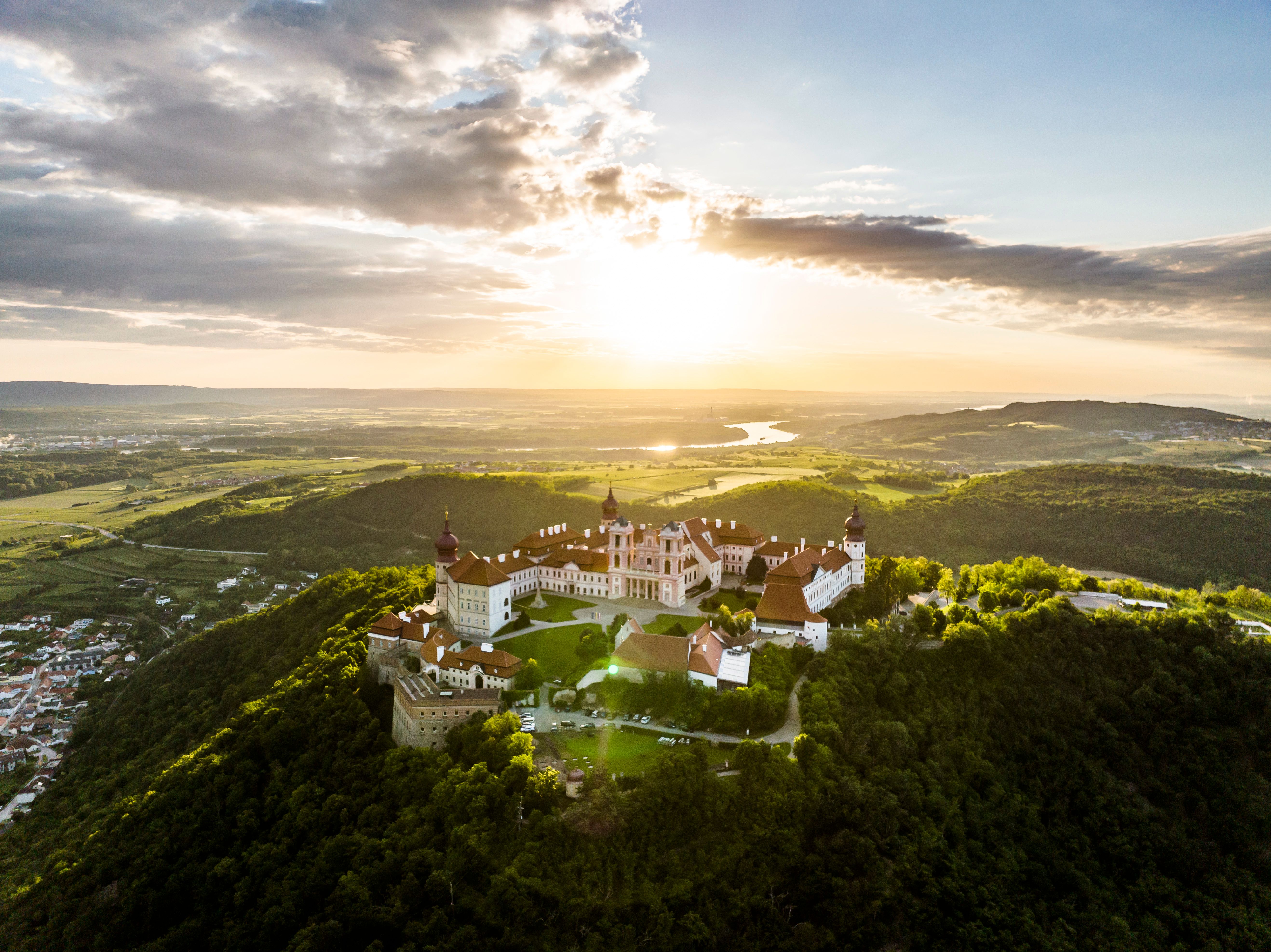 Aerial view of Göttweig Abbey in Austria, surrounded by forest.