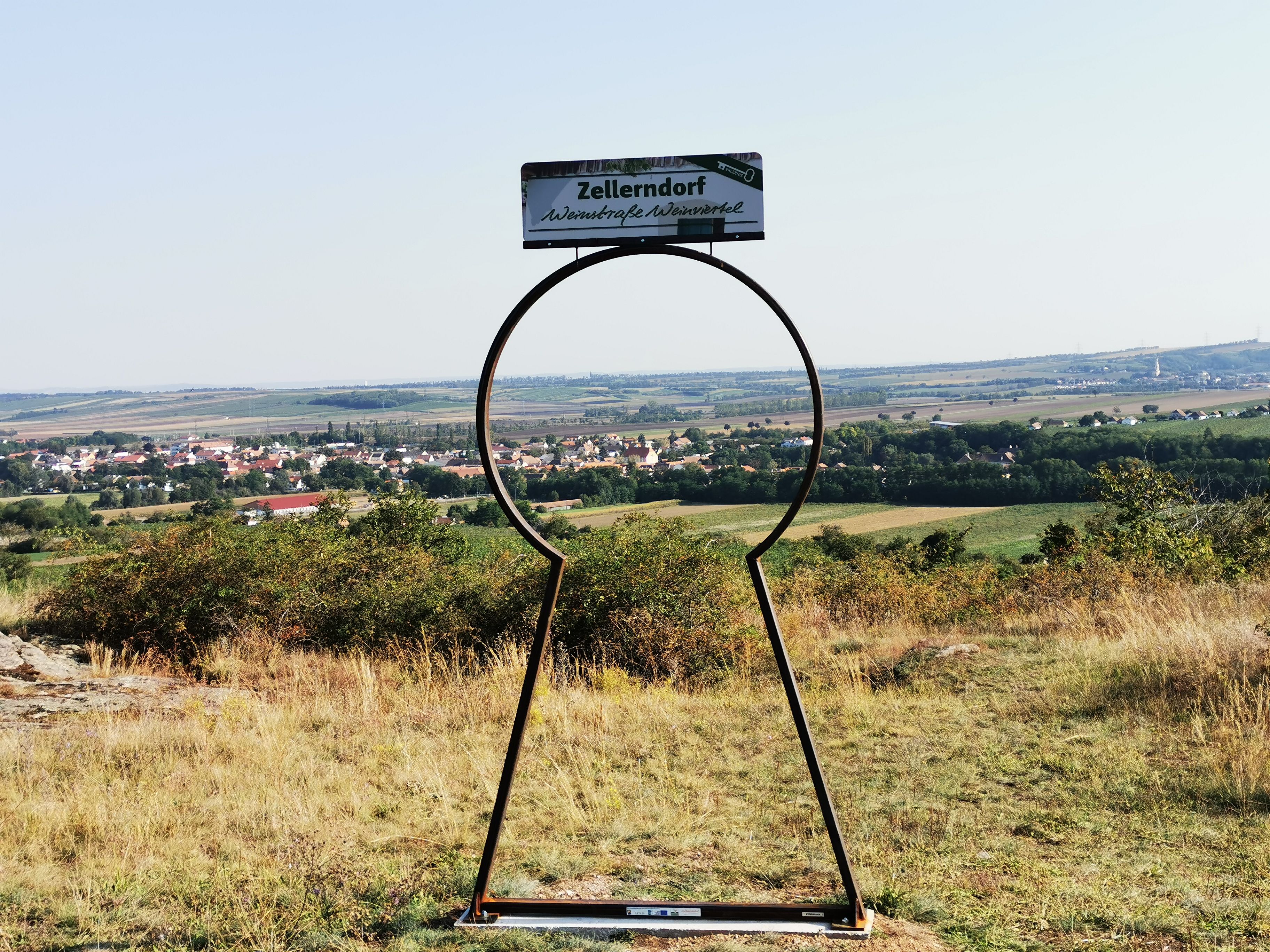 View of Zellerndorf through a key-shaped metal sculpture.
