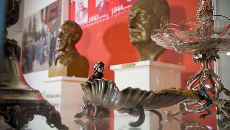 Exhibits in the Krupp Stadt Museum Berndorf, including busts and decorative objects.