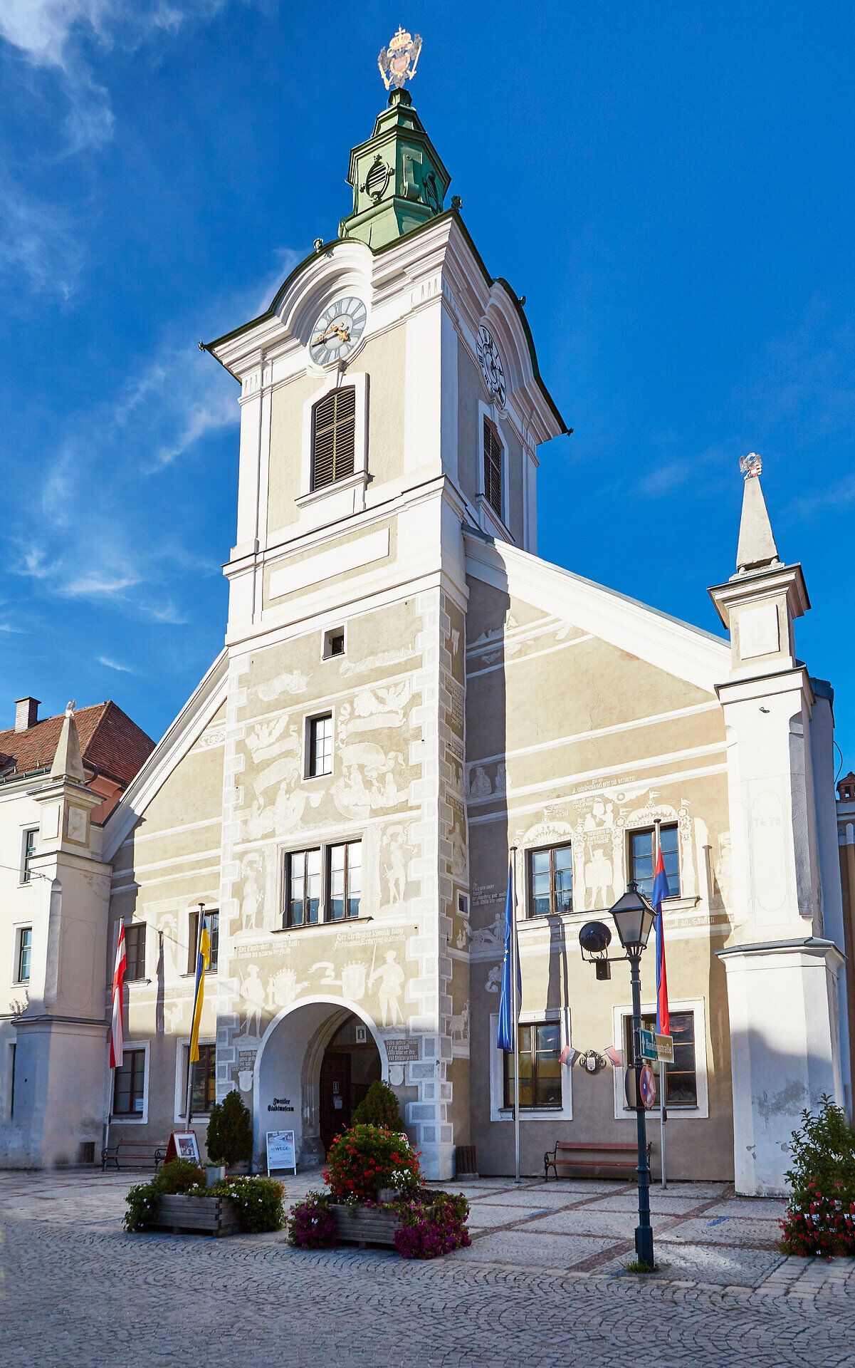 Historic building with tower and frescoes in Zwettl, Austria.