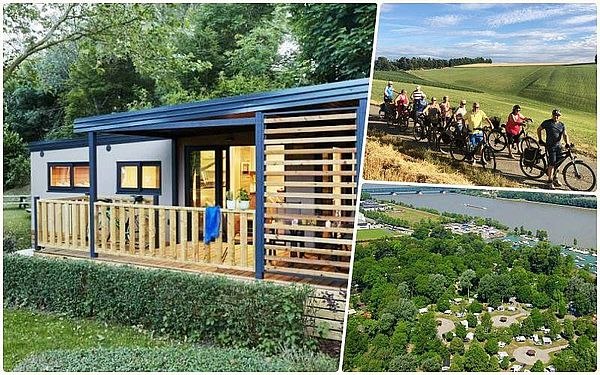 Mobile home from the outside standing on a green meadow with terrace, inset of photo with cyclists and campsite from above