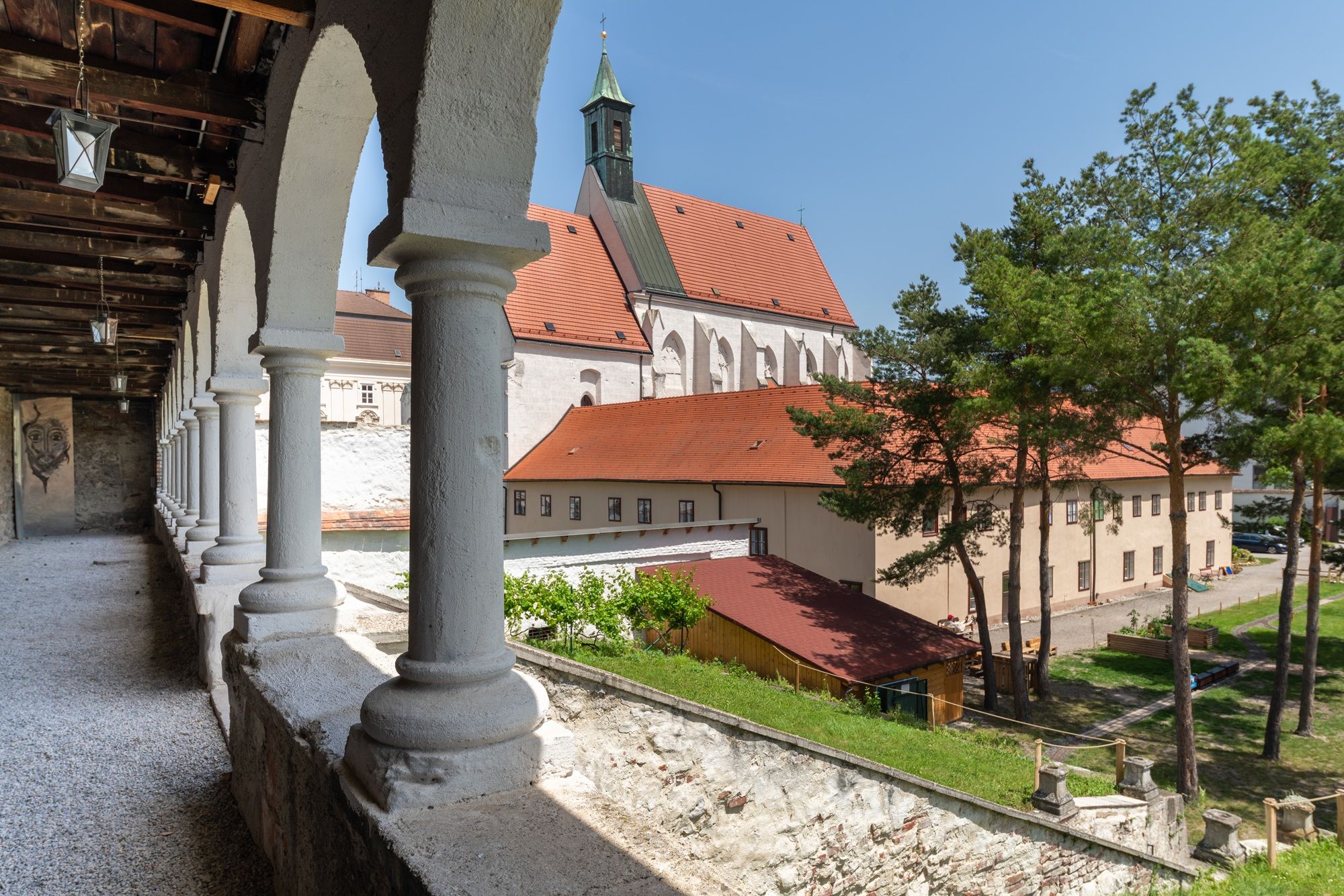 View of the Capuchin church in Wiener Neustadt with arcades in the foreground.