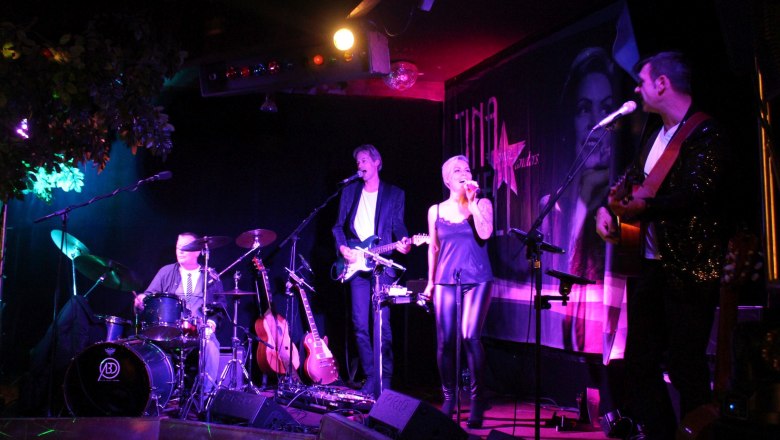 Band performance in the Preiner Stadl with singer and musicians on stage.