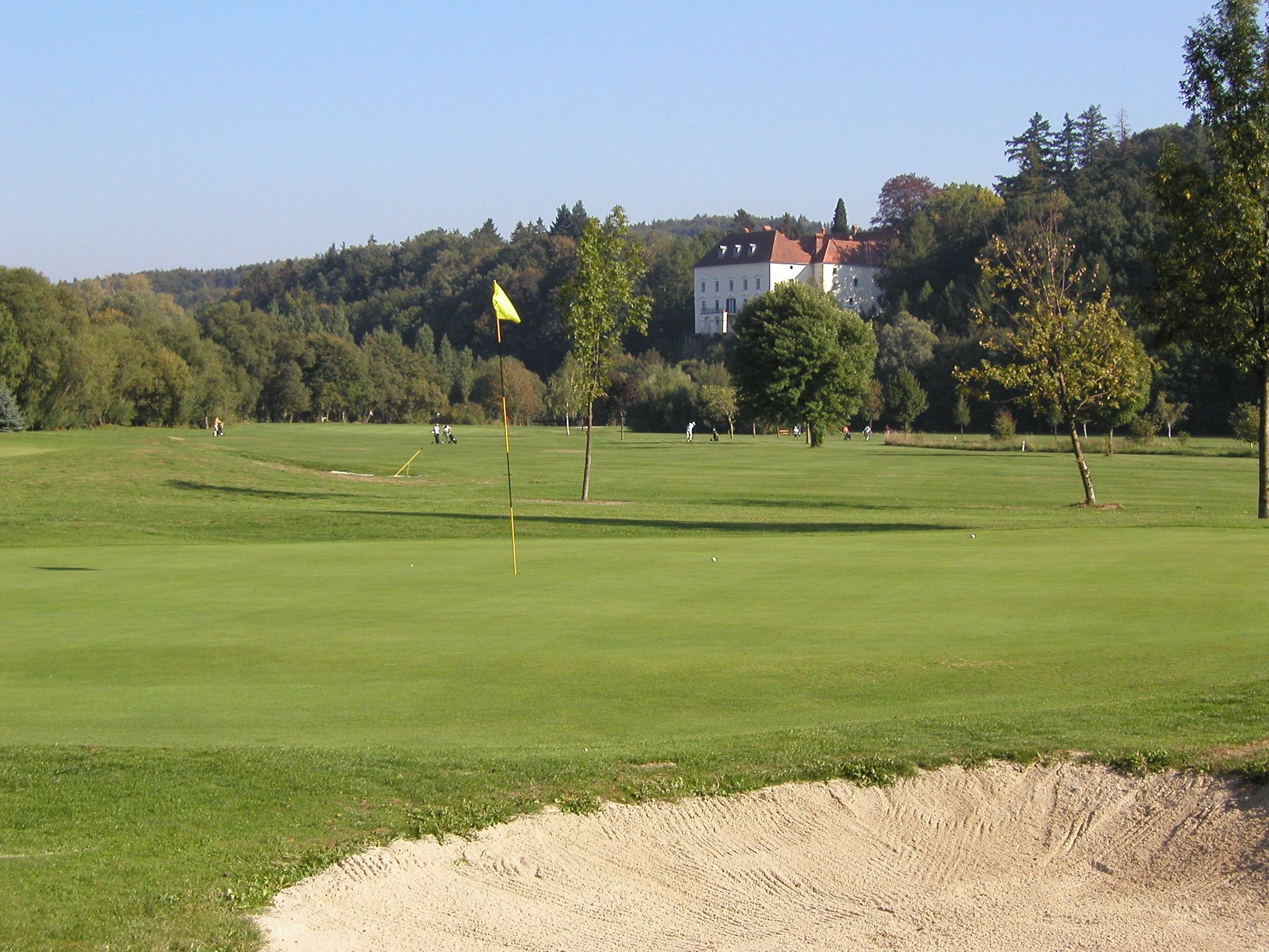 Golf course with castle in the background.