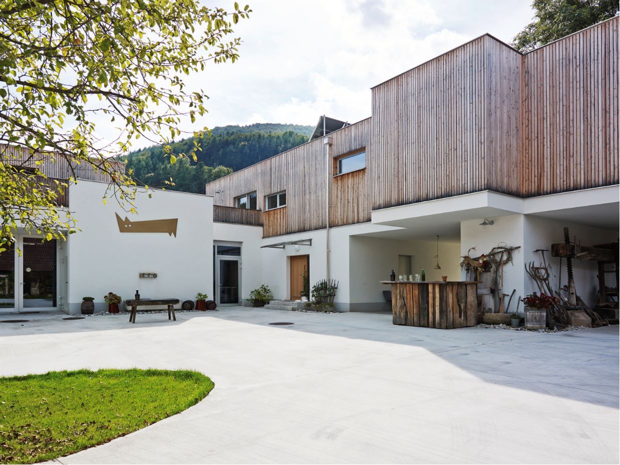 Modern building with wooden cladding and inner courtyard.